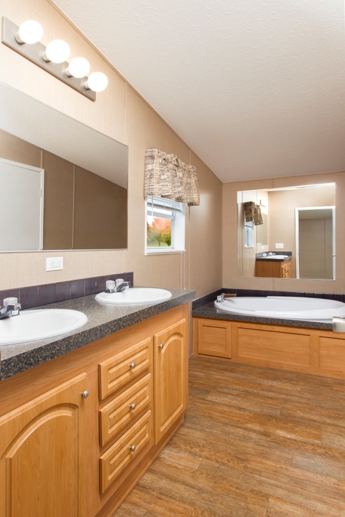 The Peyton model master bath featuring a double-sink vanity and bathtub