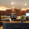The Miley Plus model kitchen with updated appliances and wooden cabinets